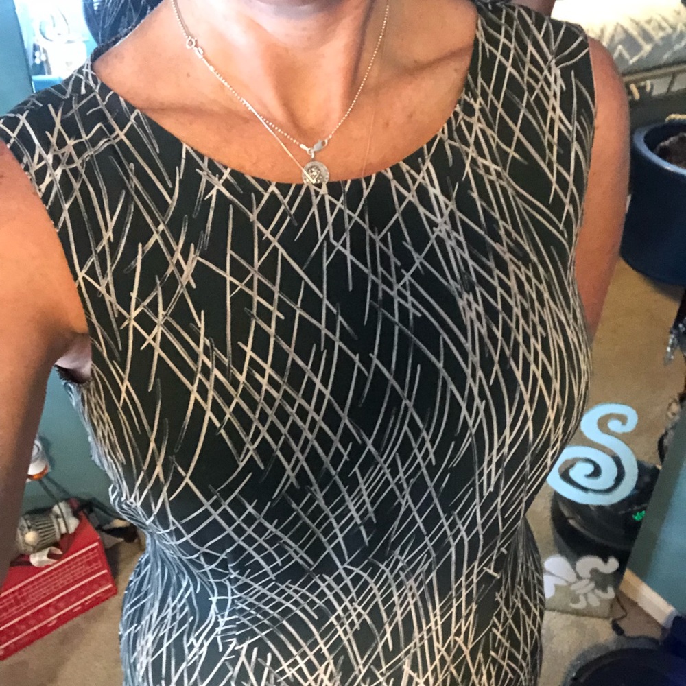 Sleeveless dark green dress w/ cream lines